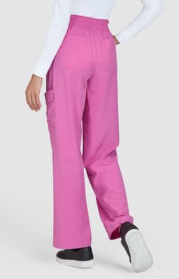 A pair of pink pants with a relaxed fit, featuring cargo pockets and an elastic waistband, worn from the back.