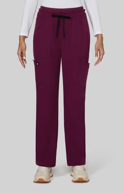 A pair of wide leg pants in deep burgundy with pockets and a drawstring waist. They feature a small logo on the side.