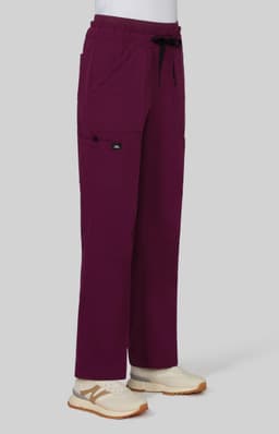 A pair of wide leg pants in a deep maroon colour, featuring pockets and an elastic waistband, displayed on a mannequin.