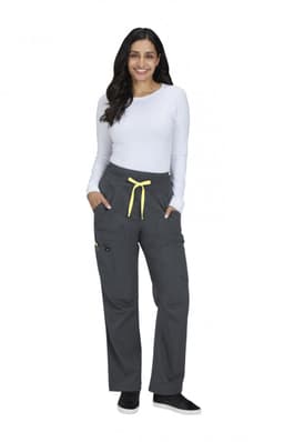 A pair of grey wide-leg pants with a yellow drawstring and pockets, worn by a smiling model in a white top.