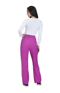 A person wearing wide leg pants in bright pink, viewed from the back, with a white long-sleeve top.