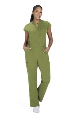 A model wearing a green Anja Jumpsuit features a zippered front and pockets, styled with a casual look.