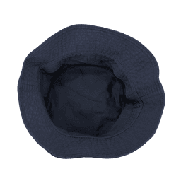 A bucket hat in navy blue with a textured surface and an empty interior. It has a logo on the side.