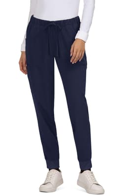 Navy Aster Pants with a drawstring waist and pockets, paired with a white top and casual shoes.