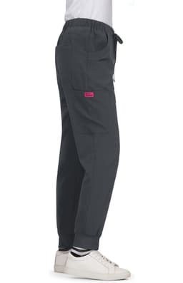 A pair of grey Aster Pants featuring pockets and a logo, styled with a drawstring waist and cuffs.