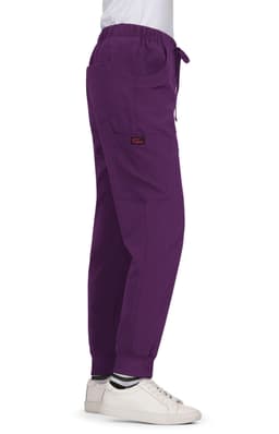A pair of purple Aster Pants featuring pockets and an elastic waistband, displayed on a model side view.