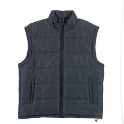 A man is wearing a grey puffer vest over a black long-sleeve shirt, paired with blue jeans. The vest has a logo.