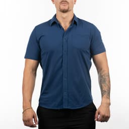 A short sleeve shirt in navy blue featuring a front pocket and a button-up design. It has a logo on it.