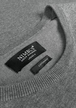 A grey knitted jumper featuring a round neckline and a label with branding.