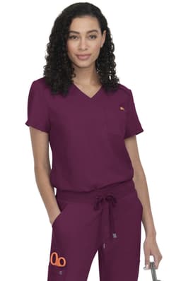 A scrub top in deep burgundy with a logo, featuring a V-neck and short sleeves, paired with matching trousers.