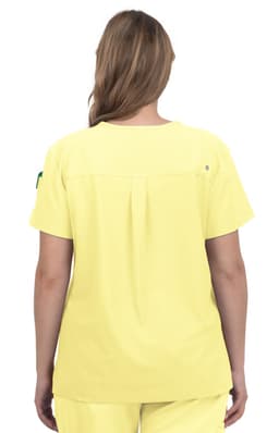 A yellow medical scrubs top with a plain back and a small logo on the sleeve.