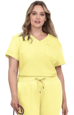 A model wearing a yellow V-neck top with a pocket, paired with matching yellow joggers.