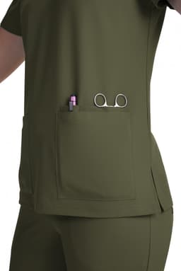 A green scrub top with a side pocket featuring a pen and scissors. The top has a simple design and a fitted look.