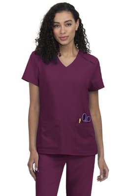 A women's scrubs top in a deep burgundy colour, featuring two front pockets and a V-neck design.