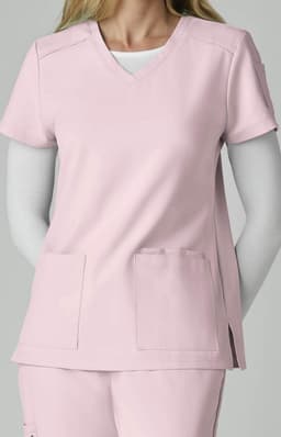 A pink scrub top with short sleeves and two front pockets, featuring a V-neckline.