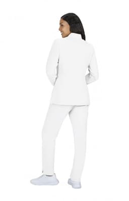 A white women's jacket paired with matching trousers, featuring a structured design and a logo on the garment.