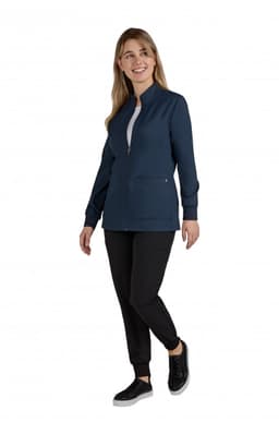 A navy women's jacket with a zip front and two side pockets, paired with black pants and sneakers.