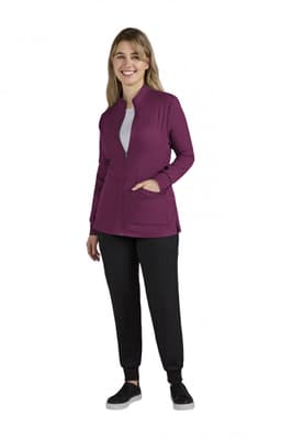 A women's jacket in a rich purple colour, featuring a zip front and pockets, paired with black trousers.