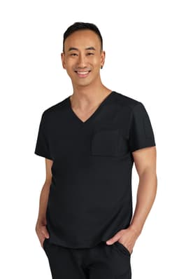A black medical scrub top with a V-neck and a chest pocket, featuring a smiling male model.
