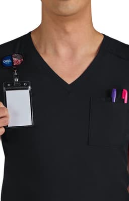 A person wearing a black v-neck scrubs top, featuring a pocket with two pens and a name badge holder.