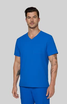 A man wearing a bright blue V-neck scrubs top with a pocket, paired with blue scrub pants.