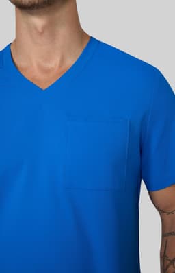 A blue v-neck t-shirt featuring a pocket on the left side. The shirt is displayed on a model.