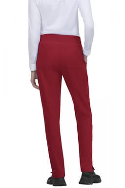 Atria Pant in red, featuring a simple design with a back view and pockets. Also includes a logo.