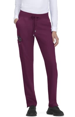 Atria Pant in deep plum, featuring a drawstring waist and side pockets, with an understated logo.