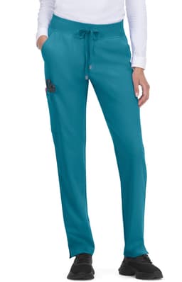 Atria Pant in teal, featuring a drawstring waist and pockets, worn by a model with a long-sleeved top.