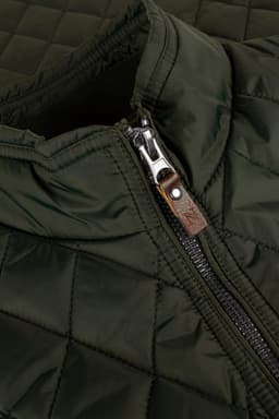 A quilted green vest featuring a zip closure and a leather accent on the zipper.