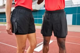 Black ladies' running shorts with a sleek design, featuring a logo on the side. Suitable for sports activities.