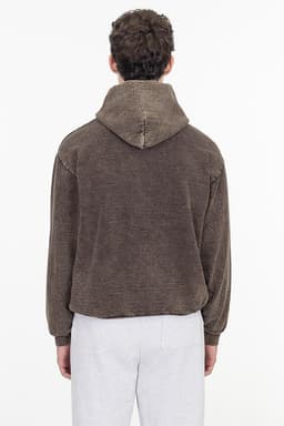 A brown heavy fleece hooded pullover viewed from the back, featuring a relaxed fit and a hood.