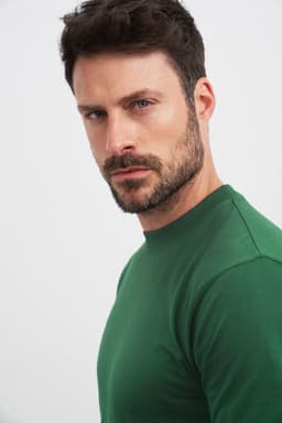A green Round-T Heavy t-shirt displayed on a model, showcasing a fitted style and crew neck design.
