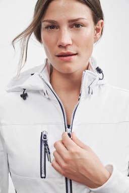 A white Ladies Maritime Jacket with a hood, featuring zippered pockets and a logo.