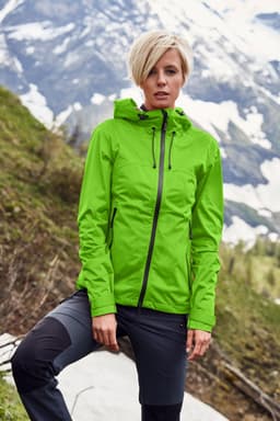 A bright green ladies' outdoor jacket with a hood, set against a mountainous backdrop. The jacket features a logo.