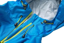 A blue ladies outdoor rain jacket with yellow drawstrings and a textured inner lining. It features a hood and zippered front.