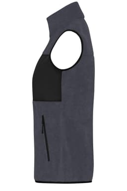 A grey ladies fleece vest featuring a black panel and a zippered pocket on the side. It has no sleeves.