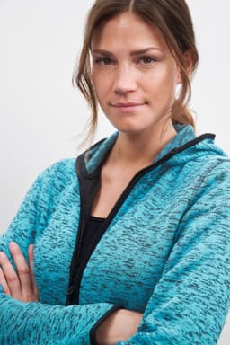 A hooded jumper in a blue and black knitted fleece with a zip front. It features a logo.