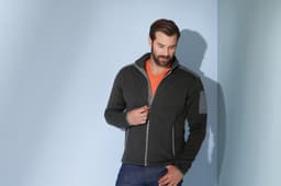 A men's knitted fleece jacket in dark grey with a contrasting collar, featuring a logo on the left sleeve.