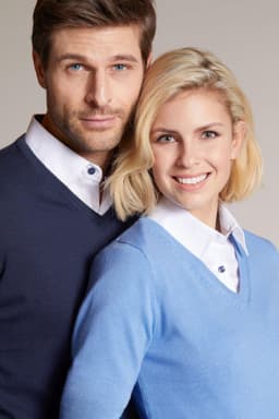 Blue V-neck pullover featuring a knitted texture, worn by a man in navy and a woman in blue, both with white collars.