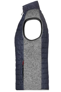 A ladies' knitted hybrid vest featuring a navy blue quilted design and a grey knitted centre panel. It has no sleeves.