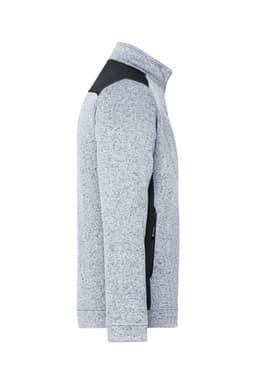A grey and black men's knitted workwear fleece jacket featuring a zip and functional pockets.