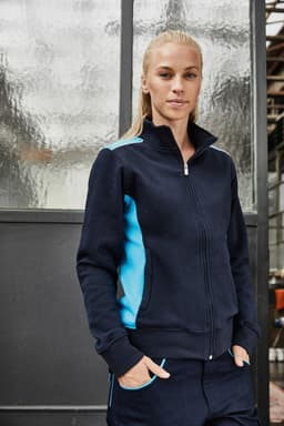 A navy blue workwear sweat jacket with light blue side panels, featuring a zip front and high collar.