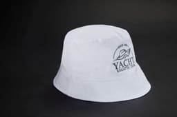 A white bucket hat featuring a logo, made from durable fabric for casual wear.
