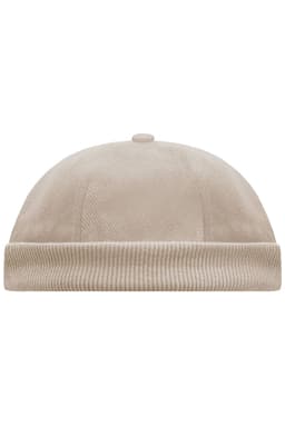 A beige 6-panel chef cap with a rounded top and ribbed band at the base. It features a small button on top.