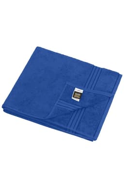 A blue sauna sheet folded neatly with subtle texture and a branded label visible.