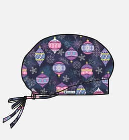 A printed unisex bouffant cap featuring a festive pattern of colourful ornaments on a dark background with ties.