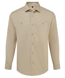 A beige button-up shirt with long sleeves and two chest pockets. It features a logo on the chest.