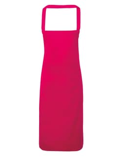 A bright pink 100% organic cotton bib apron with adjustable straps and no visible branding.