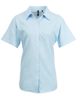 Light blue women's short-sleeve button-up shirt with a collar and a logo on the chest.